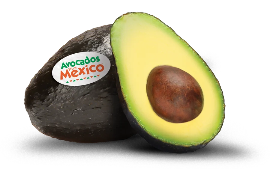 A whole Avocados From Mexico avocado next to a ripe halved avocado